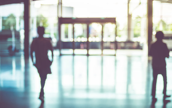 Blur background,silhouette of Business man walking at corridor i
