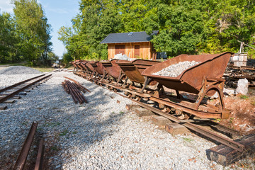 Limestone mine tracks and carts in natural forest in Bohemia, Czech Republic