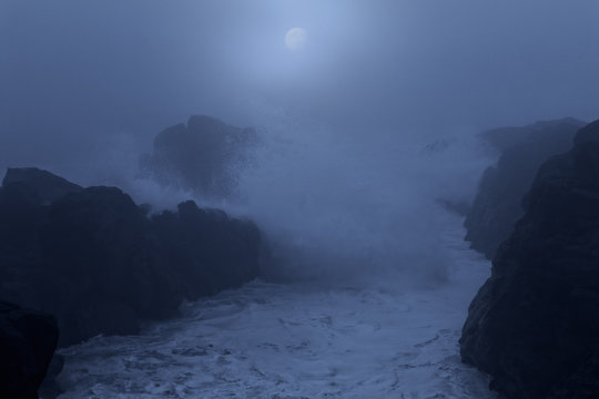 Fototapeta Dangerous rocky coast at night