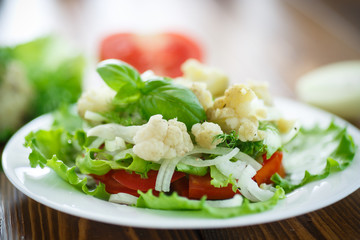 salad with cauliflower, tomatoes and herbs