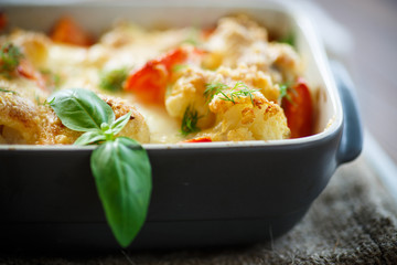 Cauliflower baked with  tomatoes