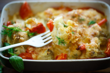 Cauliflower baked with  tomatoes