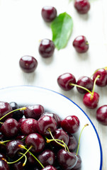sweet cherry on a plate on wooden table