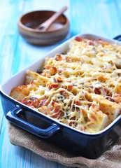 baked toasted baguette with ham, cheese, leek and cream sauce. French cuisine.