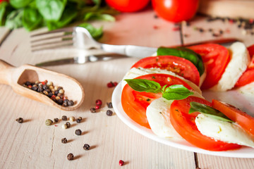 Caprese with tomatoes, mozzarella and basil