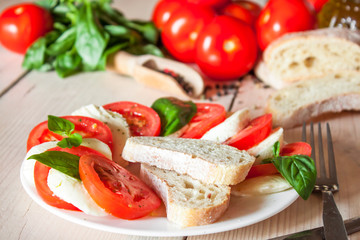 Caprese with tomatoes, mozzarella and basil
