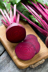 fresh sliced beetroot on wooden surface