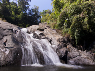 Naklejka na ściany i meble waterfall in the tropical forest where is in Thailand National Park