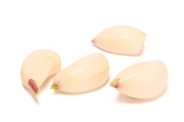 Three slices of garlic on a white background.