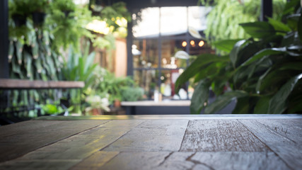 wood table with blur interior decoration style garden background