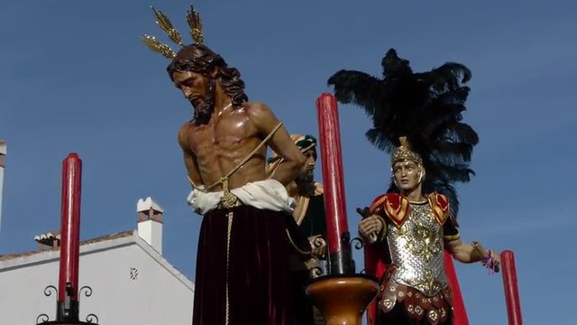  Father Jesus stripped of his garments, accompanied by a Roman man and whip  