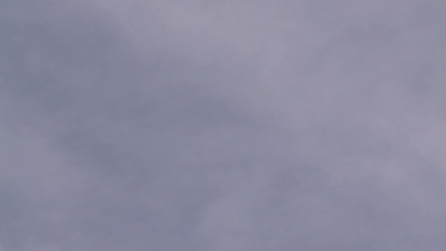 Plane descending from the clouds