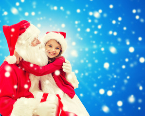 smiling little girl with santa claus