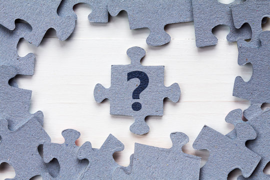 Jigsaw puzzle and question mark - Powered by Adobe