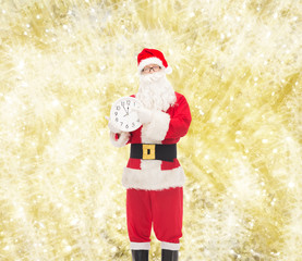 man in costume of santa claus with clock