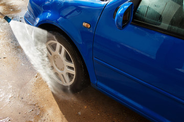 Blue car in a car wash