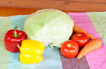 Composition with raw vegetables on table