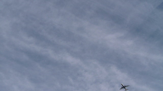 Plane descending from the clouds
