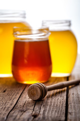 Bowl of honey on wooden table