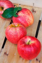Red apples in a wooden case