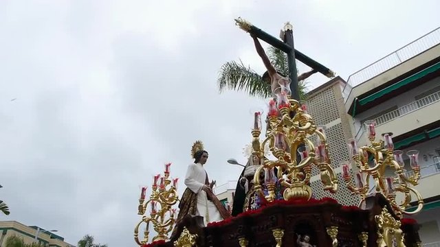   Brotherhood of Christ of the Good Death and St. John the Evangelist, in the streets of Almu&ntilde;ecar, with cloudy sky