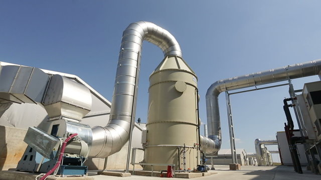 New modern industrial waste plant pipelines from the outside. Waste-to-energy plant. Produces a combustible fuel commodity, such as methane, methanol, ethanol and synthetic fuels.