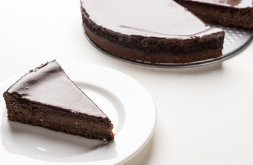 Chocolate cheesecake on the white background