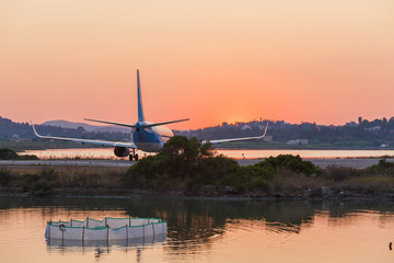 Fototapeta na wymiar Airplane before take-off, evening scene, Corfu