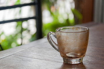 Empty glass of coffee on wood table