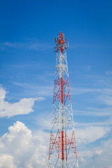 telecommunication tower in the middle of the picture with cloudy