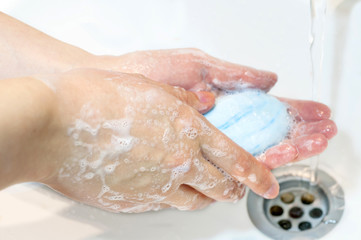 Washing of hands with blue soap