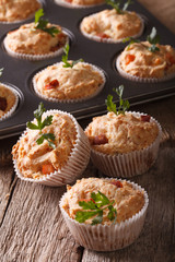 muffins with meat and cheese close-up on the table. vertical
