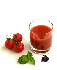 Glass of tomato juice isolated on white