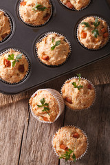 muffins with ham and cheese in baking dish closeup. vertical top view
