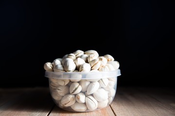Pistachio put in bowl and place on wood floor