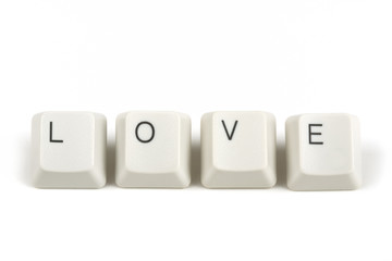 love from scattered keyboard keys on white