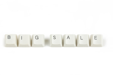 big sale from scattered keyboard keys on white