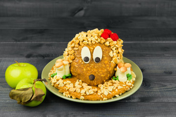 Cake made in the form of a hedgehog with mushrooms