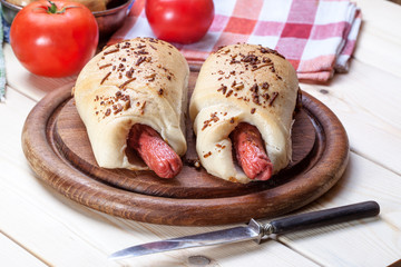 Sausage baked in dough.