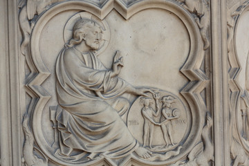 Paris -  the Sainte-Chapelle (Holy Chapel).The base of the portal on both sides is decorated with low relief representing scenes of the Genesis