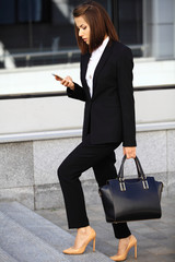 Young businesswoman having a conversation using a smartphone 