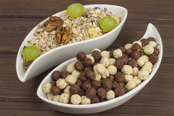 Healthy Diet breakfast of oatmeal, cereal and fruit. Foods full of energy for athletes. The concept of diet food. Preparing homemade breakfast. Vegetarian diet. Food on a wooden table.
