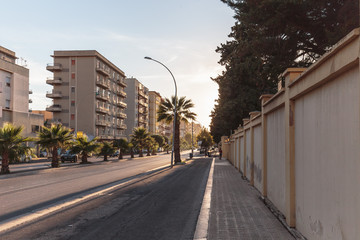 TRAPANI, ITALY - SEPTEMBER 26 2015: Mediterranean City of Trapani on Sicily on a warm early autumn day. Lovely warm colors of the popular salt city at the coast
