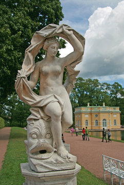 ST. PETERSBURG, TSARSKOYE SELO, RUSSIA - JUNE 26, 2008: The Galatea sculpture in the Catherine Park. On the background is Upper Bathhouse Pavilion