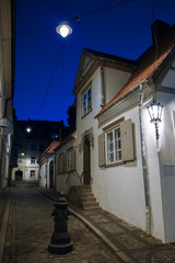 Medieval street at dusk in old city of Riga, Latvia