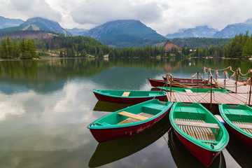 Fototapeta na wymiar Colorful wooden boat on mountain lake .