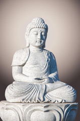 Stone statue of Buddha isolated