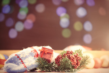 Mittens and gift box with Christmas lights