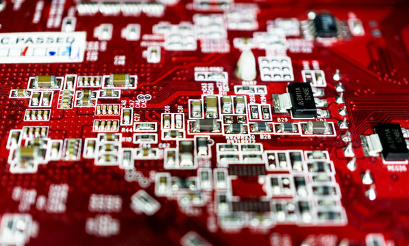 Red computer motherboard with blur effect macro