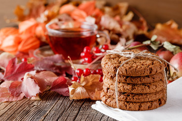 Fall harvesting on rustic wooden table with oat cookies